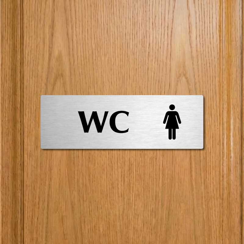 WC ženy, 240x79mm, stříbrná popiska s dvojtým rámečkem